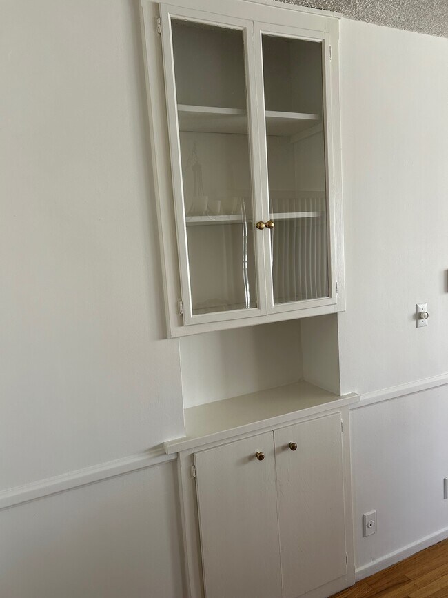 Cabinets opposite Dining Table - 919 S Sherbourne Dr