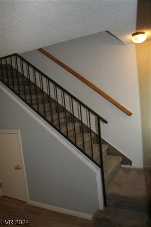 Small, half door under stairs storage. Stairs lead to 2 bedrooms and shared bathroom. - 2616 Aracatuba Ave