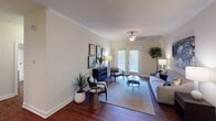 Located at 2428 Arbor Village Lane in Fort Mill, South Carolina, this single-floor residence offers a well-organized layout designed for comfortable everyday living. The living room serves as the heart of the home, featuring rich hardwood-style flooring, crown molding, and a ceiling fan overhead. Natural light filters in through French doors that open to the outdoors, creating a bright and welcoming atmosphere. The space is generously proportioned, accommodating a full seating arrangement with ease.

The kitchen is equipped with warm-toned wood cabinetry extending to the ceiling with crown molding detail, granite countertops, a double-basin sink, and a full suite of stainless steel appliances including a refrigerator, range, and over-the-range microwave. Recessed lighting and hardwood-style flooring complete the functional and attractive space.

The bedrooms are carpeted and receive natural light through windowed views of the surrounding greenery. Each bedroom benefits from dedicated closet space, including a walk-in closet with wire shelving. The bathrooms feature hardwood-style flooring, granite-topped vanities with wood cabinetry, and one includes a shower-tub combination. The overall ambiance throughout is neutral, clean, and move-in ready.