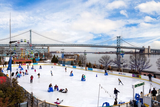 Residents flock to Ben Franklin Bridge in Old City each winter for ice skating by the river.