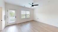 Located at 101 Fox Grape Loop in Weaverville, NC, this well-appointed two-story home offers three bedrooms, four bathrooms, and a thoughtfully designed layout spread across two balanced floors. The main level features a standout kitchen with sage-toned shaker cabinetry, white quartz countertops, a large center island with an undermount sink, subway tile backsplash, stainless steel appliances including a French door refrigerator, and striking matte black pendant lighting. Light luxury vinyl plank flooring and a ceiling fan complement the bright, open living area, which benefits from natural light and exterior door access. Upstairs, the spacious primary bedroom is carpeted and ceiling fan-equipped, offering a generous walk-in closet with wire shelving. Additional bedrooms are similarly carpeted with ample natural light from well-placed windows. The bathrooms are finished in a clean, modern style — one featuring a glass-enclosed walk-in shower with black fixtures and subway tile, another with a full tub-shower combo and oil-rubbed bronze hardware. Two dedicated closets provide practical storage throughout. The home's neutral palette, consistent finishes, and two-story layout create a cohesive, move-in-ready living environment.