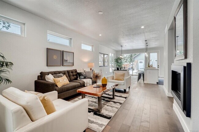 Building Photo - Spacious and Elegant 4-Bedroom Home in the Highlands w/ 3rd Floor Balcony!