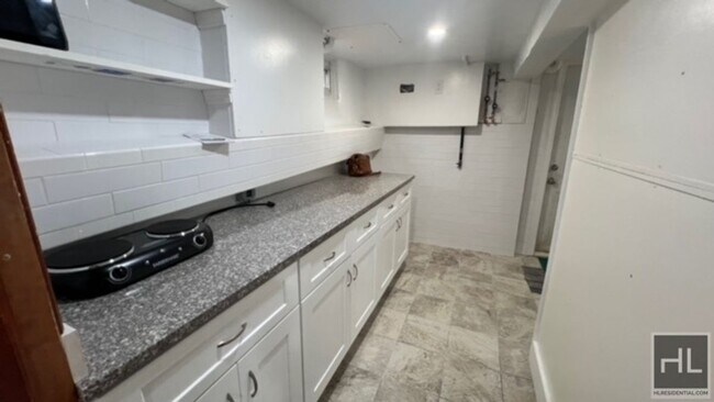 Building Photo - LARGE SEMI- BASEMENT STUDIO FOR HARDEN STR...