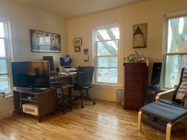 Corner of the living/dining room, looking out towards Monore Street. - 25 Monroe St
