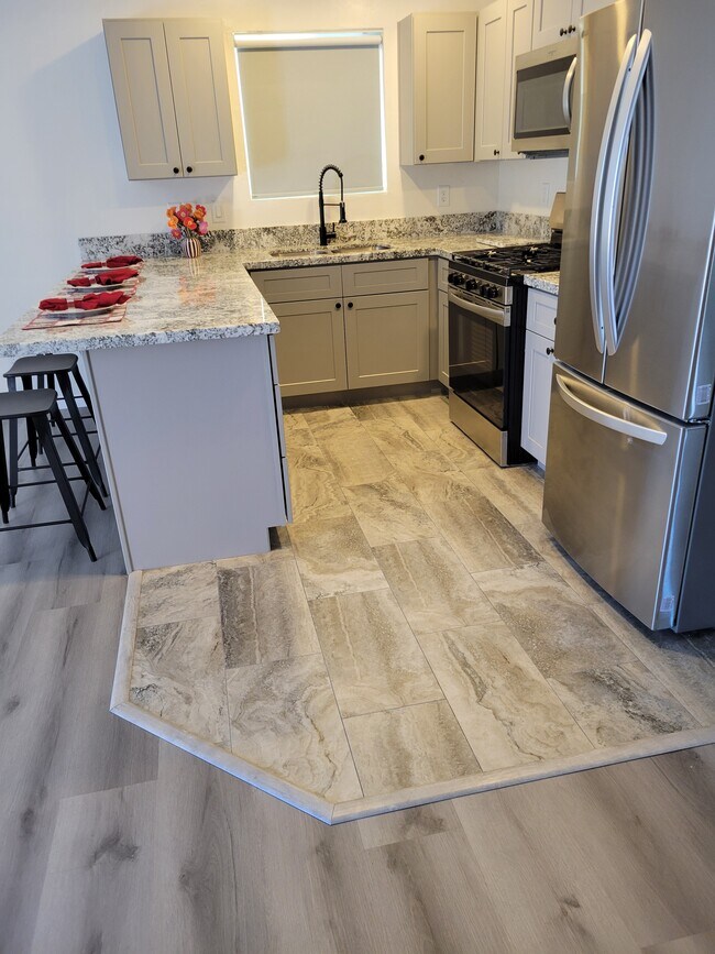 Custom tile in kitchen and bathrooms - 8396 E Stevens Dr