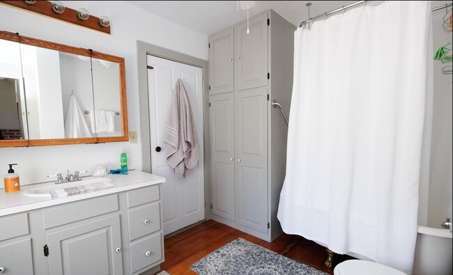 Just off the bedroom is a well appointed bathroom with plenty of storage. - 256 Main St