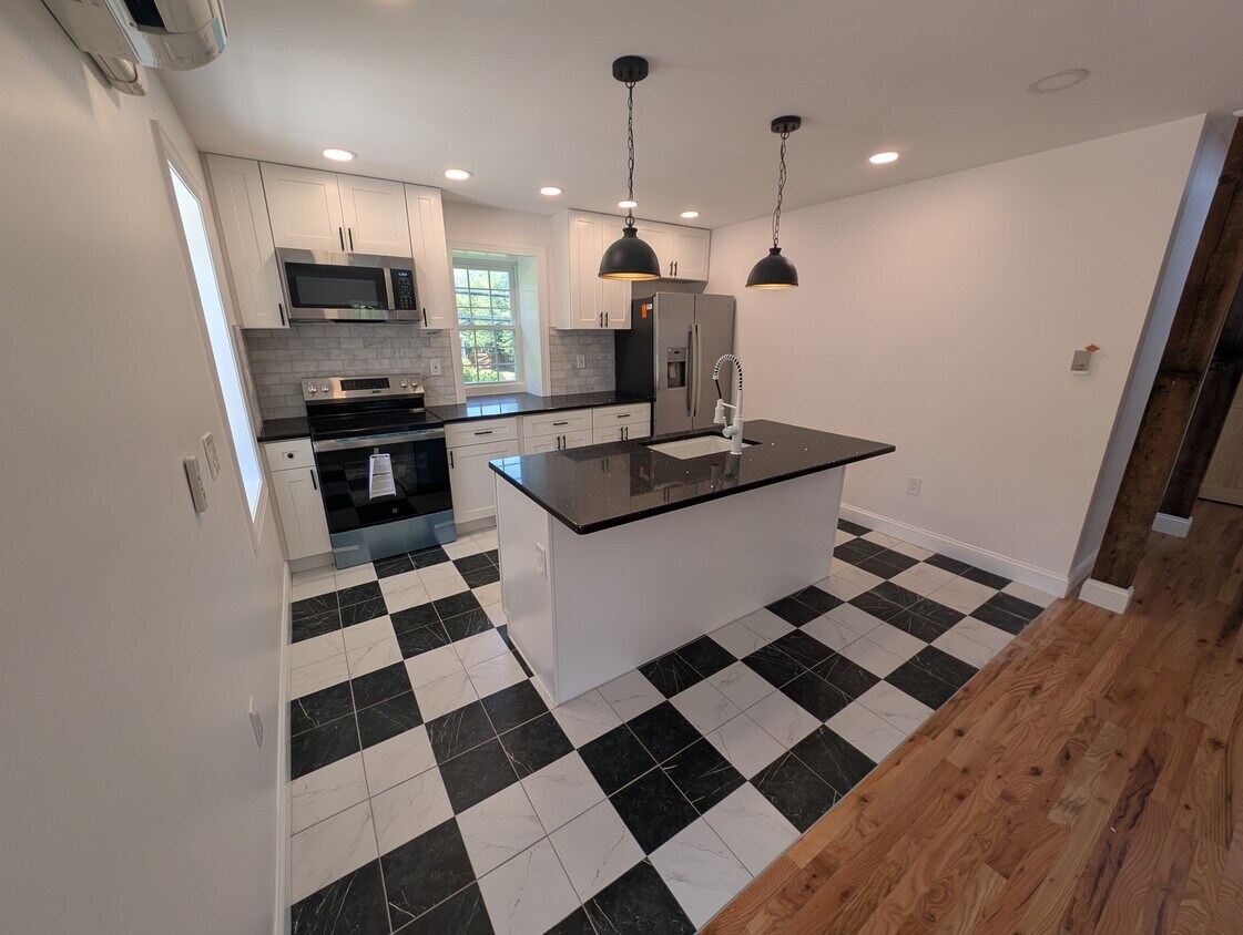 Kitchen view from front door - 131 W Walnut Ln