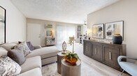 Located at 850 N Benson Ave in Upland, California, this 2-bedroom, 1-bathroom residence offers a well-organized single-floor layout that maximizes every square foot. The living room serves as the heart of the home, featuring warm light wood-style flooring, neutral wall tones, and sliding glass doors that invite natural light and provide outdoor access. A ceiling fan adds comfort to the open feel of the space. The galley-style kitchen is thoughtfully designed with white cabinetry, dark countertops, brushed nickel hardware, a double stainless steel sink, and black appliances including a gas range and refrigerator — all complemented by matching light wood-style flooring. The primary bedroom offers plush carpeting, a large closet, and a window with sheer curtains that allow soft, diffused natural light to fill the room. The second bedroom similarly features carpet and a textured ceiling, providing a quiet, comfortable retreat. The full bathroom includes a clean white tiled tub-and-shower combination with chrome fixtures, maintaining a bright and functional aesthetic. A hallway connects the rooms efficiently, completing this practical and cohesive floor plan ideal for comfortable everyday living.