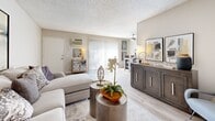 Located at 850 N Benson Ave in Upland, California, this 2-bedroom, 1-bathroom residence offers a well-organized single-floor layout that maximizes every square foot. The living room serves as the heart of the home, featuring warm light wood-style flooring, neutral wall tones, and sliding glass doors that invite natural light and provide outdoor access. A ceiling fan adds comfort to the open feel of the space. The galley-style kitchen is thoughtfully designed with white cabinetry, dark countertops, brushed nickel hardware, a double stainless steel sink, and black appliances including a gas range and refrigerator — all complemented by matching light wood-style flooring. The primary bedroom offers plush carpeting, a large closet, and a window with sheer curtains that allow soft, diffused natural light to fill the room. The second bedroom similarly features carpet and a textured ceiling, providing a quiet, comfortable retreat. The full bathroom includes a clean white tiled tub-and-shower combination with chrome fixtures, maintaining a bright and functional aesthetic. A hallway connects the rooms efficiently, completing this practical and cohesive floor plan ideal for comfortable everyday living.