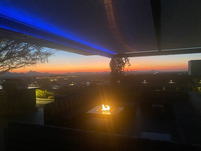 Rooftop includes fireplaces, large TVs and kitchen for entertaining - 7180 E Kierland Blvd