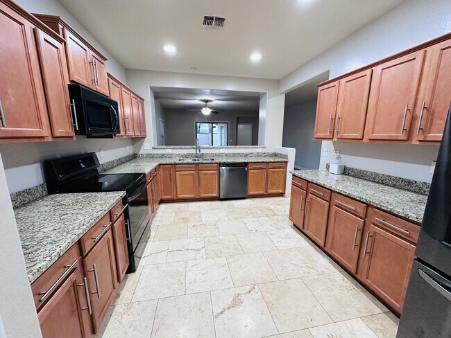 Kitchen with newer graphite appliances - 18215 W Townley Ave