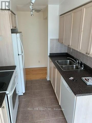 Photo du bâtiment - 1-1501 Elm Dr W