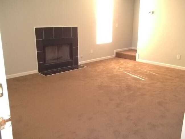 Building Photo - Freshly painted and new flooring in this 4 Bedroom 2 and Half Bath home. Covered front porch with...