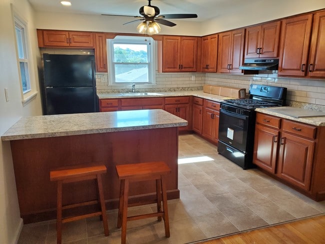 Kitchen with Island and Stools - 216 Glen Ave
