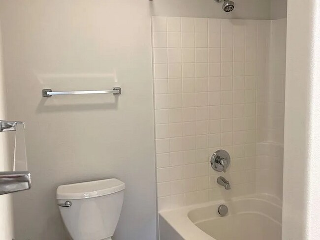 Building Photo - this ranch-style home features 4 bedrooms and 2 bathrooms.