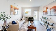 Located at 2500 SW 22nd Ter in Fort Lauderdale, Florida, this well-designed one-bedroom, one-bathroom residence offers a thoughtful layout across a single floor. The open-concept kitchen and living area serves as the heart of the home, where a modern kitchen impresses with two-tone cabinetry — white uppers paired with warm wood-toned lowers — a striking navy blue tile backsplash, white quartz countertops, and a full suite of stainless steel appliances including a French door refrigerator, range, microwave, and dishwasher. A curved island with bar seating adds both functionality and style. The adjacent living room is bright and airy, featuring large windows that invite natural light and provide outdoor views, complemented by light tile flooring throughout. The bedroom is a comfortable retreat equipped with a ceiling fan, a sliding window with outdoor views, and access to a spacious walk-in closet outfitted with built-in wire shelving and ample hanging space. The bathroom is clean and contemporary, featuring large-format tile flooring, a glass-enclosed shower, and a well-appointed vanity. Together, these spaces create a cohesive, modern living environment ideal for South Florida living.
