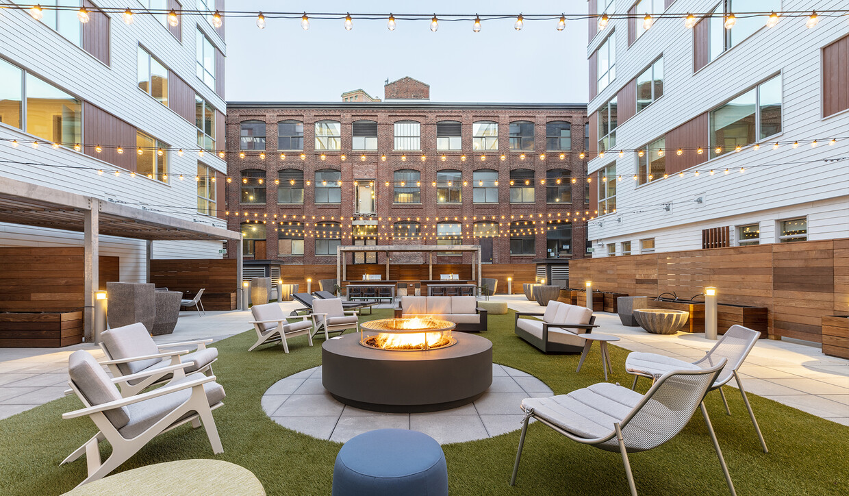 Your new home includes a large central social area with firepits, fitness center, and co-working spaces. - Prism