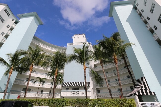 Exterior condo entry from catwalks overlooking pool area - 3250 NE 28th St