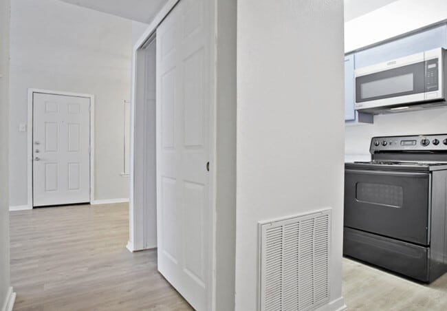 Spacious Living Area – Open floor plan with wood-style flooring in Terrell TX - Adelaide