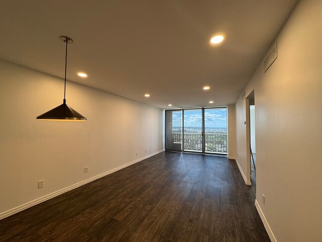 Living room with updated dimmable LED lighting. - 1502 S Boulder Ave