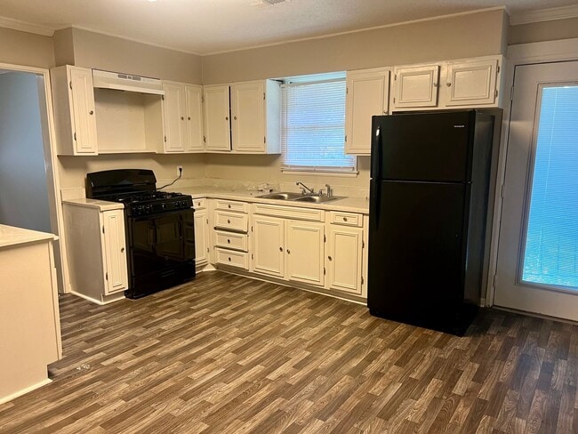 Building Photo - Available Now!! Lawn service included**