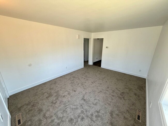 Building Photo - For Rent: 2 Bedroom, 1 Bathroom Home with Garage and Large Yard