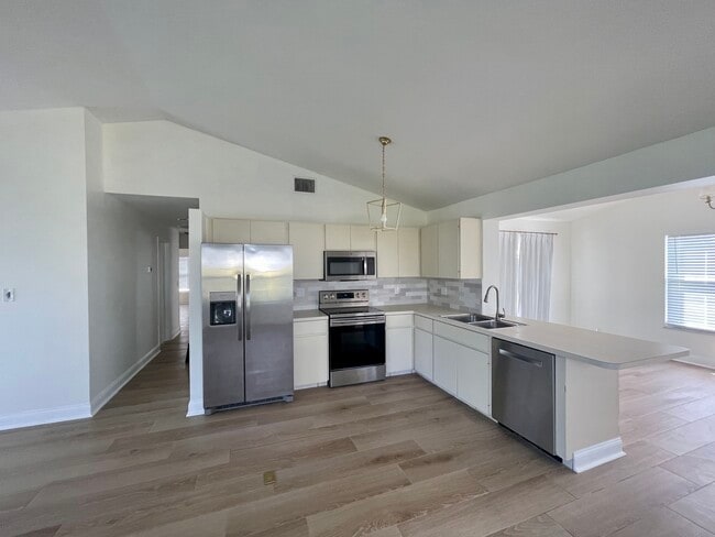 Kitchen- updated appliances - 7399 SE Flamingo Way