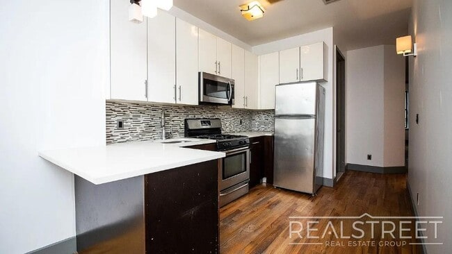 Building Photo - Gut-Renovated 3BR + Massive Finished Basement | Backyard, Laundry & HVAC | Bushwick