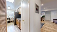 Located at 25 Cinder Rd in Edison, NJ, this well-appointed single-floor residence offers a thoughtful layout across one bedroom and one bathroom. Light-toned luxury vinyl plank flooring runs throughout the main living areas, creating a cohesive and clean aesthetic.

The galley-style kitchen is a standout feature, equipped with warm wood cabinetry, granite countertops, a decorative tile backsplash, and stainless steel appliances including a gas range and refrigerator. A dining area with a window is positioned at the end of the kitchen, allowing natural light to fill the space.

The living room is open and versatile, with recessed lighting, soft blue-gray walls, and ample room for both seating and a workspace. Framed artwork and a large area rug add character to the room.

The bedroom is generously proportioned, featuring plush wall-to-wall carpeting, multiple windows that invite natural light, and a large sliding-door closet offering abundant storage.

The bathroom is neatly finished with large-format tile flooring, a tub-shower combination enclosed by a glass sliding door with marble-style surround, a wood vanity, and granite countertop. Three hallways connect the rooms efficiently, contributing to the home's functional flow throughout.