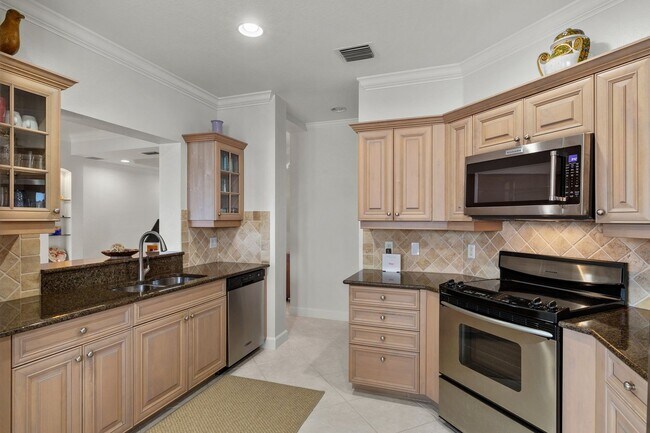 Building Photo - ** Rarely Available - Coach Home in The Co...