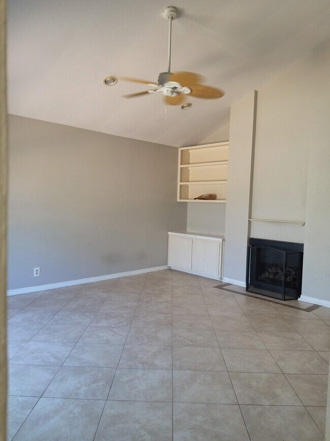 Large living room with all tiled floors. - 18681 Maplewood Cir