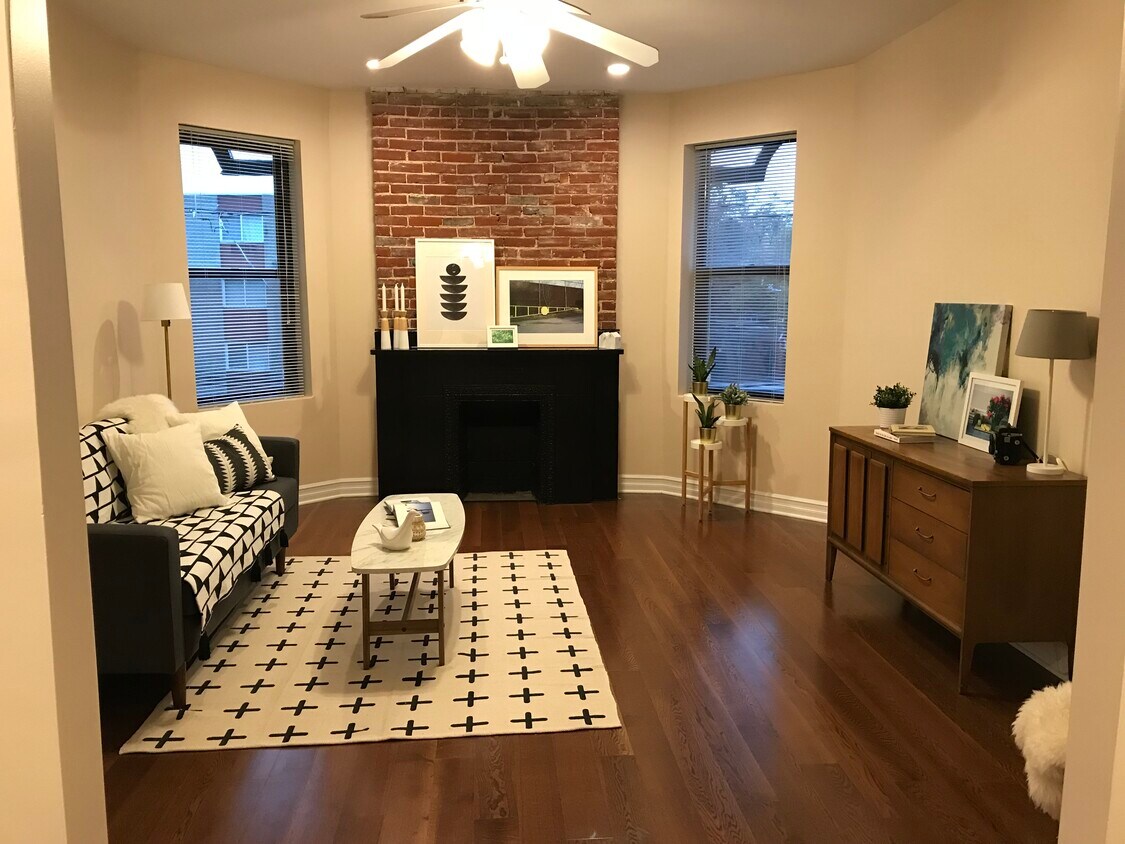 Bright living room with decorative fireplace - 5960 Alder St