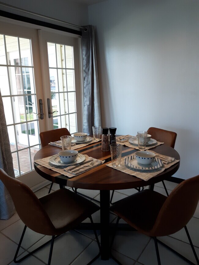 Dining space with French doors to patio - 15421 Seamount Cay Ct