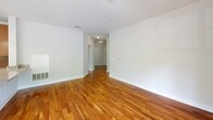Located at 3500 Corriere Rd in Easton, PA, this well-appointed 2-bedroom, 2-bathroom residence offers a thoughtfully designed single-level layout. Rich hardwood flooring flows throughout the main living areas and bedrooms, creating a warm and cohesive aesthetic.

The open-concept kitchen and living room serves as the heart of the home. The kitchen is equipped with stainless steel appliances, including a range, microwave, and refrigerator, complemented by rich wood cabinetry, granite countertops, and a central island with pendant lighting and an undermount sink — ideal for both cooking and casual dining. The living room extends naturally from the kitchen and opens to a private balcony overlooking a lush, tree-lined outdoor setting.

Both bedrooms are generously proportioned, featuring the same warm hardwood floors and large windows that invite natural light. The primary bedroom offers a comfortable, well-sized retreat. Each bathroom is finished with granite-topped wood vanities, framed mirrors, and clean tile flooring, reflecting a consistent and refined design language throughout.

A hallway connects the rooms efficiently, and the overall layout makes excellent use of the available space. The serene greenery visible from the balcony adds a natural backdrop to this inviting Easton residence.
