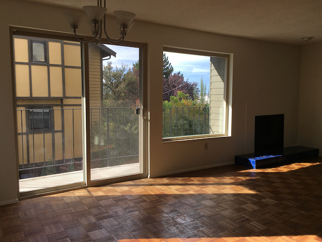 West-facing windows in living/dining area. - 4511 Greenwood Ave N