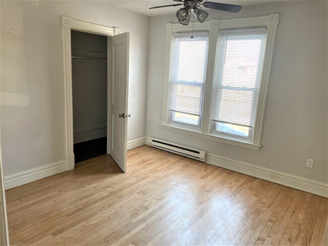 Bedroom 1 with walk-in closet - 610 Jessamine Ave E