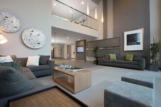 Leasing office featuring warm design and a friendly onsite team at Aster Apartments in Dublin, CA. - Aster
