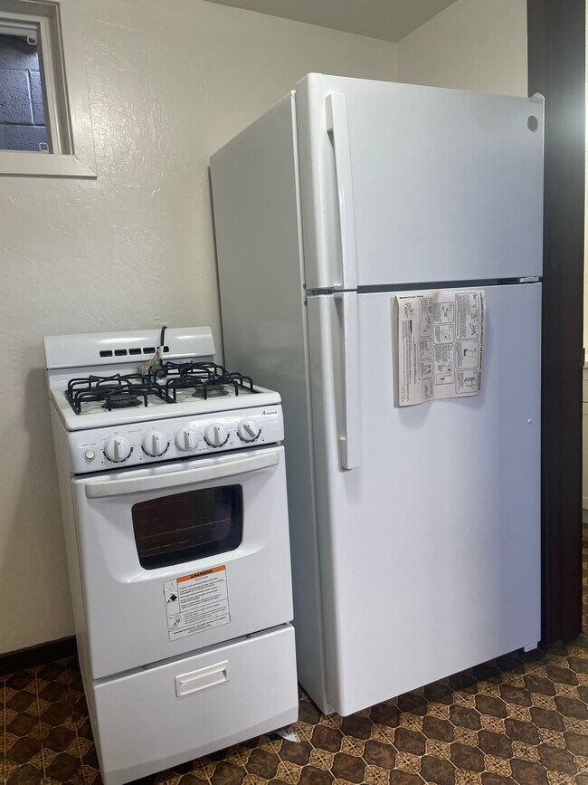 New refrigerator, with gas stove - 1927 Kalani St