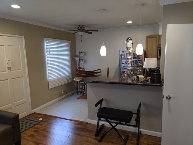 Kitchen with breakfast bar and recessed lights - 230 W Holly Ave