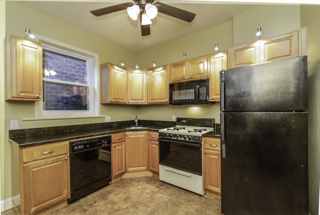 Kitchen with over the cabinet lighting in the central ceiling fan - 252 42nd St