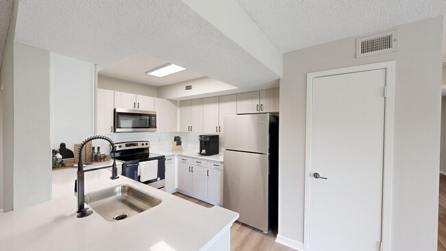 Newly Renovated Kitchen with Quartz Countertops - 1250 West Apartments