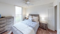 Located at 1221 Ala Kapuna St in Honolulu, Hawaii, this single-floor residence offers a well-organized layout designed for comfortable island living. The living area is bright and welcoming, featuring light wood-style flooring, a textured ceiling, and natural light streaming through large windows. The space is versatile, accommodating both a seating area and an entertainment setup with ease.

The kitchen is efficiently designed with light wood cabinetry, dark countertops, a stainless steel sink, and a gas range, providing all the essential amenities for everyday cooking. Upper and lower cabinet storage ensures ample space for organization.

The primary bedroom is generously proportioned, featuring carpet flooring, a ceiling fan, and a large window that allows natural light and outdoor views of lush greenery. A second bedroom offers a cozy layout with carpet flooring and built-in closet storage with louvered doors, while a third bedroom provides a clean, neutral space with carpet flooring and a built-in desk area.

The full bathroom is appointed with light wood-style flooring, a single-sink vanity with warm wood cabinetry, a large mirror, and a shower-tub combination with a curtain enclosure. The overall aesthetic throughout the residence is clean and neutral, reflecting a calm, livable atmosphere well-suited to the Honolulu lifestyle.