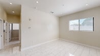Located at 29 Palmetto Dr in Miami Springs, Florida, this 2-bedroom, 2-bathroom unit offers a well-designed single-level layout with a cohesive, modern aesthetic. Marble-look porcelain tile flooring runs seamlessly throughout the entire unit, lending a clean and polished look to every room.

The kitchen is a standout feature, showcasing slate-blue shaker-style cabinetry, quartz countertops, a subway tile backsplash, and a full suite of stainless steel appliances including a range, microwave, and French door refrigerator. A central island provides additional prep and dining space, making this kitchen both functional and stylish.

Both bedrooms are bright and airy, with neutral warm-toned walls, recessed lighting, and windows dressed with horizontal blinds that allow natural light to filter in. The primary bedroom includes a spacious double sliding-door closet, offering generous storage. The second bedroom is equally comfortable with its own window and recessed lighting.

The bathrooms are thoughtfully finished, with one featuring decorative patterned floor tile, a navy blue vanity with gold hardware, and a marble-topped sink. A light-filled hallway connects the rooms and leads to a bold blue entry door, adding a pop of character to the otherwise neutral palette.