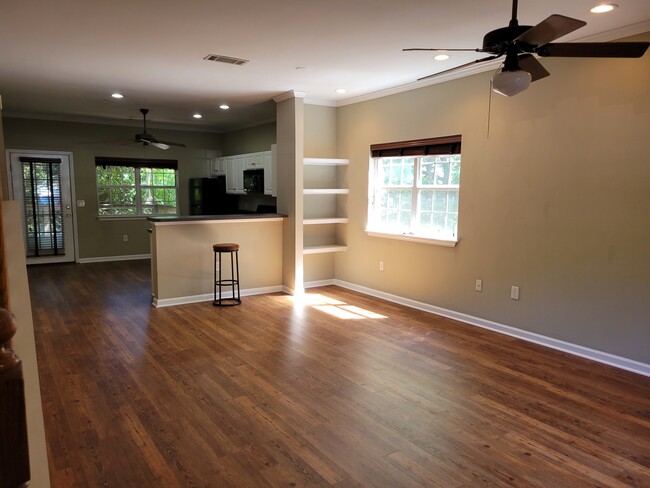 The main floor's open floor plan lets in tons of natural light - 205 Woodstone Dr