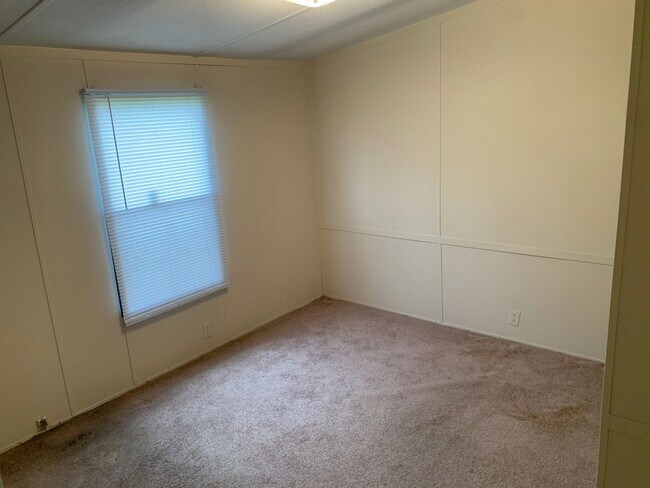 Building Photo - Doublewide Mobile Home on Large Corner Lot
