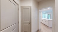 Located at 4101 William Turner Pkwy in Nashville, TN, this well-designed two-bedroom, two-bathroom residence offers a thoughtfully laid-out single-floor plan with a bright, modern aesthetic. Light wood-style flooring flows throughout the main living areas, complementing the neutral color palette that creates a clean and welcoming atmosphere.

The open kitchen and living area serves as the heart of the home, anchored by a central island with a white quartz countertop. The kitchen features an abundance of white shaker-style cabinetry, stainless steel appliances including a French door refrigerator, range, microwave, and dishwasher, all set against a crisp white backsplash.

Both bedrooms are carpeted and offer a comfortable, quiet retreat, each equipped with a ceiling fan and natural light from well-positioned windows. The primary bedroom includes a dedicated walk-in closet with wire shelving for organized storage and direct access to its en-suite bathroom. The en-suite features a walk-in shower, a white vanity with ample drawer storage, and wood-look tile flooring. The second bathroom provides a bathtub and shower combination with similar clean finishes. Two hallways and additional closets enhance practicality throughout the unit.