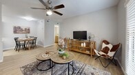 Located at 2018 Remington Dr in Arlington, Texas, this efficient one-bedroom, one-bathroom residence offers a well-designed single-floor layout that maximizes every square foot. Light-toned hardwood-style flooring runs consistently throughout the unit, creating a cohesive and airy feel from room to room.

The living room serves as the heart of the home, featuring a ceiling fan, neutral gray walls, and bright natural light streaming through large windows fitted with blinds. French doors provide an additional source of light and a welcoming entry point. The space comfortably accommodates a seating area and flows seamlessly into the dining and kitchen zones.

The kitchen is equipped with gray shaker-style cabinetry, granite countertops with white and speckled detailing, a stainless steel refrigerator, and a dishwasher — offering both style and functionality in a compact footprint.

The bedroom is a peaceful retreat, featuring its own ceiling fan, a window with natural light, and ample space for a full-sized bed and dresser. A dedicated closet provides convenient storage.

The bathroom continues the clean aesthetic with light flooring and a shower-tub combination. Throughout the unit, the consistent use of neutral tones, natural light, and modern finishes creates a comfortable and practical living environment.