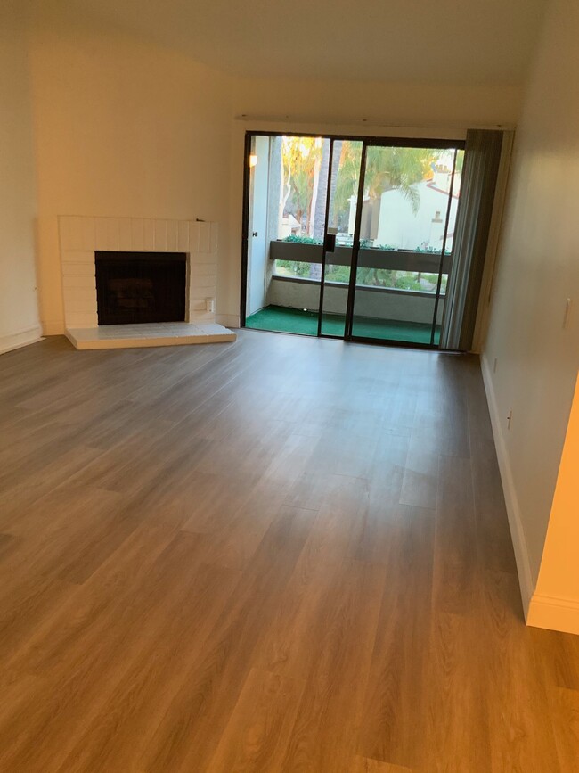 Brand new flooring through out. Working fireplace in the living room. - 21500 Califa St