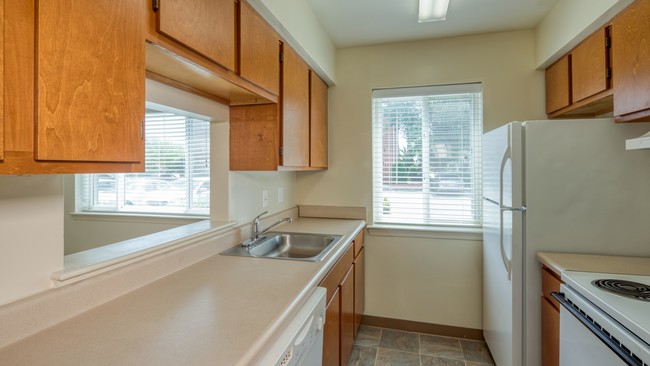 Well-lit galley kitchen - Mission College Apartments