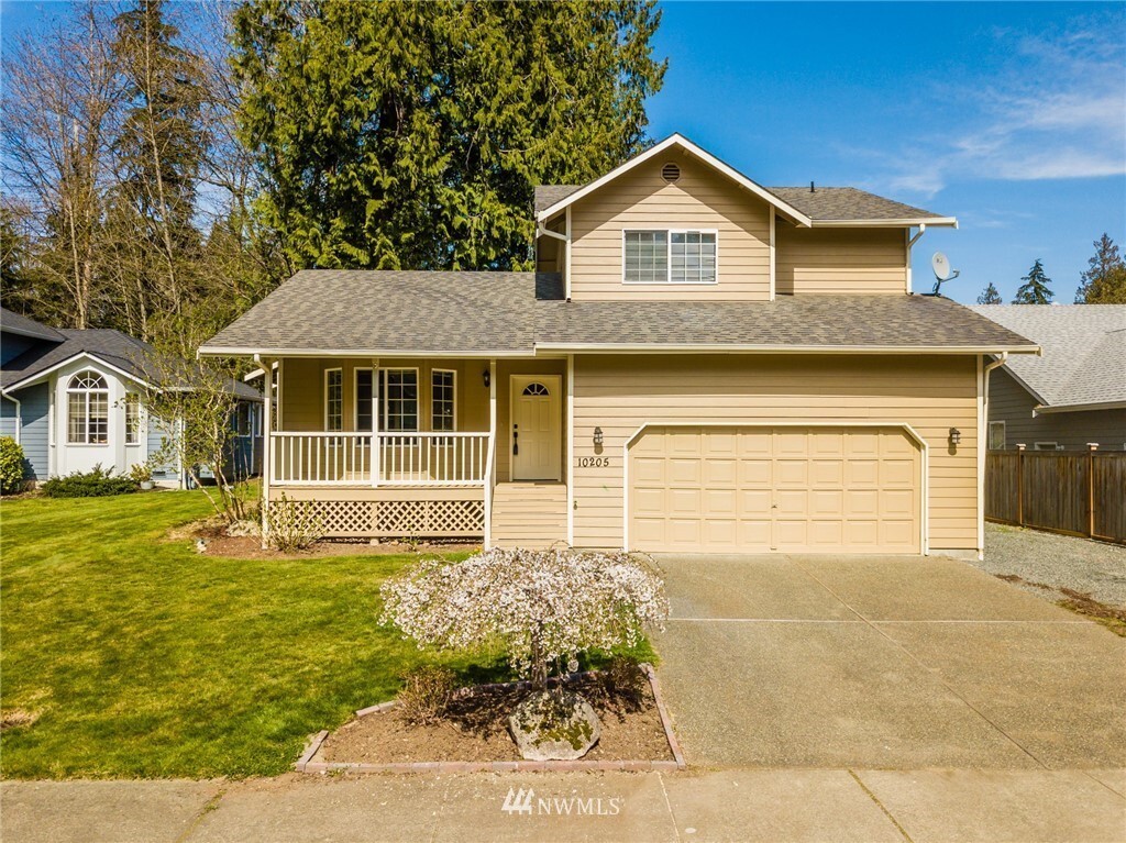 Front of house, new garage door and roof have been put on - 10205 7th Pl SE